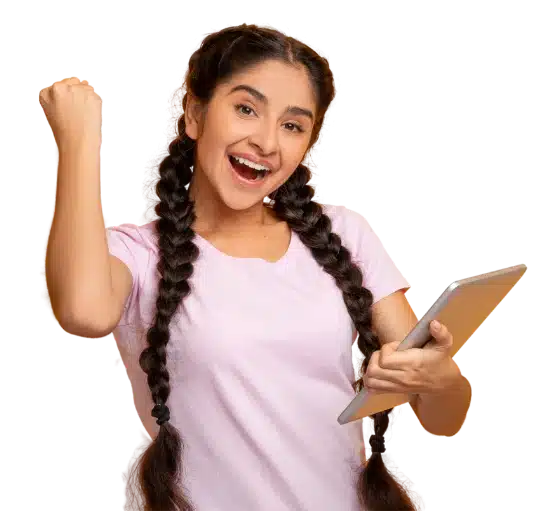 A young business owner holding a laptop in one arm pumps the air with the other.